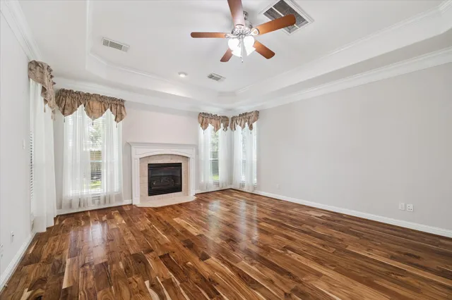 a spacious bathroom with a tub sink shower and mirror