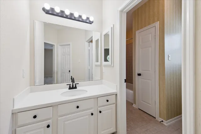 a front view of a house with a yard table and chairs