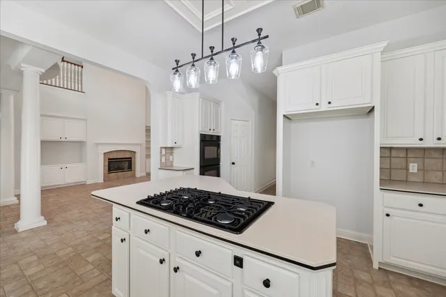 a kitchen with a stove a sink and a refrigerator