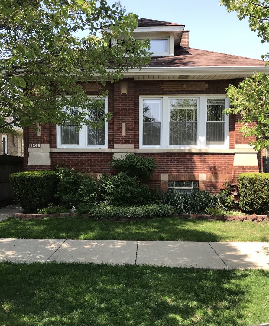 3246 West 65th Street Chicago, IL 60629 - Photo 1 of 50 a view of a house with a yard