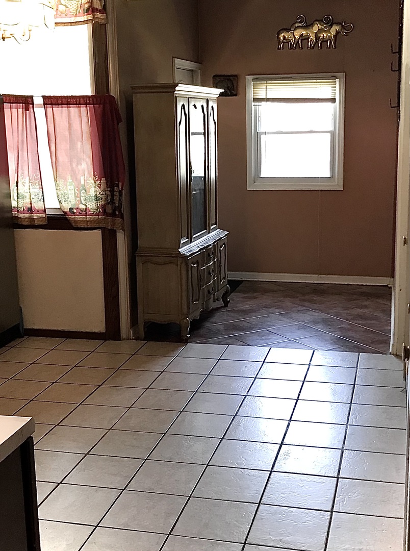 3246 West 65th Street Chicago, IL 60629 - Photo 14 of 50 a view of an empty room with a window