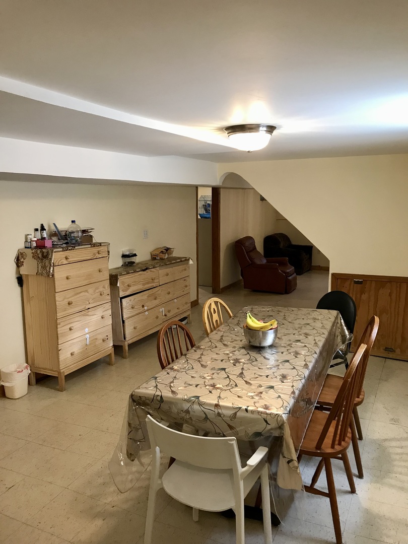 3246 West 65th Street Chicago, IL 60629 - Photo 35 of 50 a view of a dining room with furniture and a chandelier