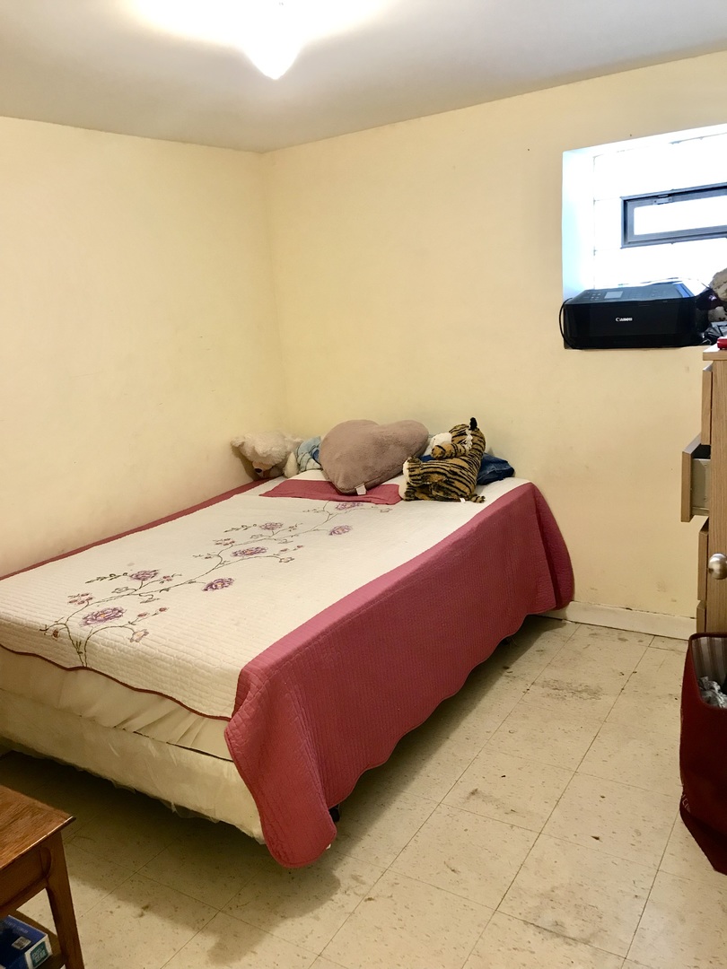3246 West 65th Street Chicago, IL 60629 - Photo 36 of 50 a bedroom with a bed and dresser