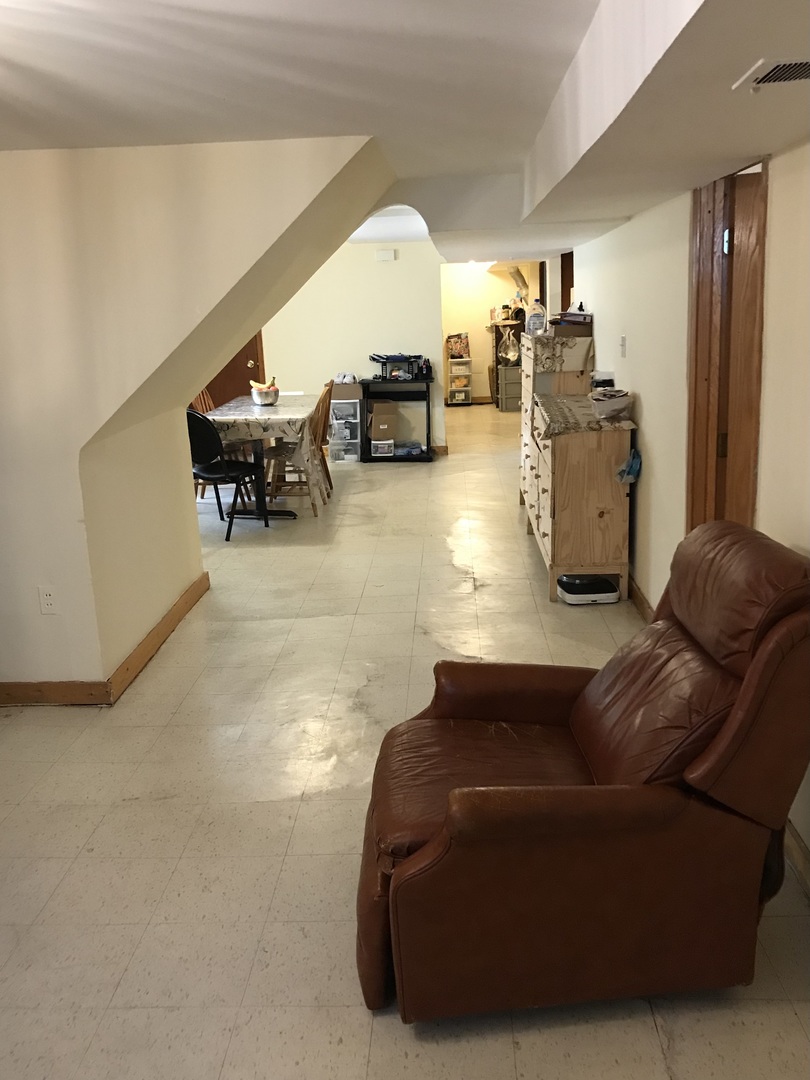 3246 West 65th Street Chicago, IL 60629 - Photo 39 of 50 a living room with furniture and a large window