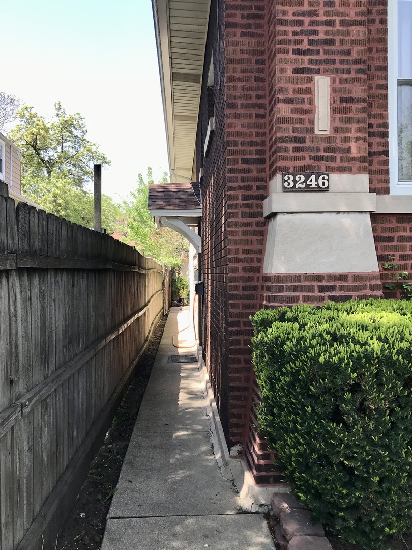 3246 West 65th Street Chicago, IL 60629 - Photo 4 of 50 a view of a pathway both side of building