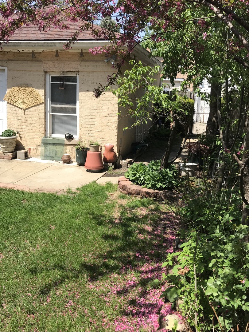 3246 West 65th Street Chicago, IL 60629 - Photo 44 of 50 a view of a house with backyard and sitting area