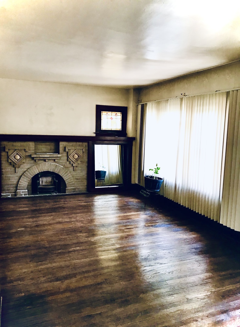 3246 West 65th Street Chicago, IL 60629 - Photo 5 of 50 a view of empty room with windows and fireplace