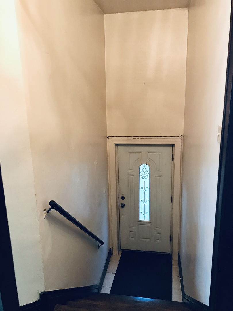 3246 West 65th Street Chicago, IL 60629 - Photo 9 of 50 a view of front door with wooden floor