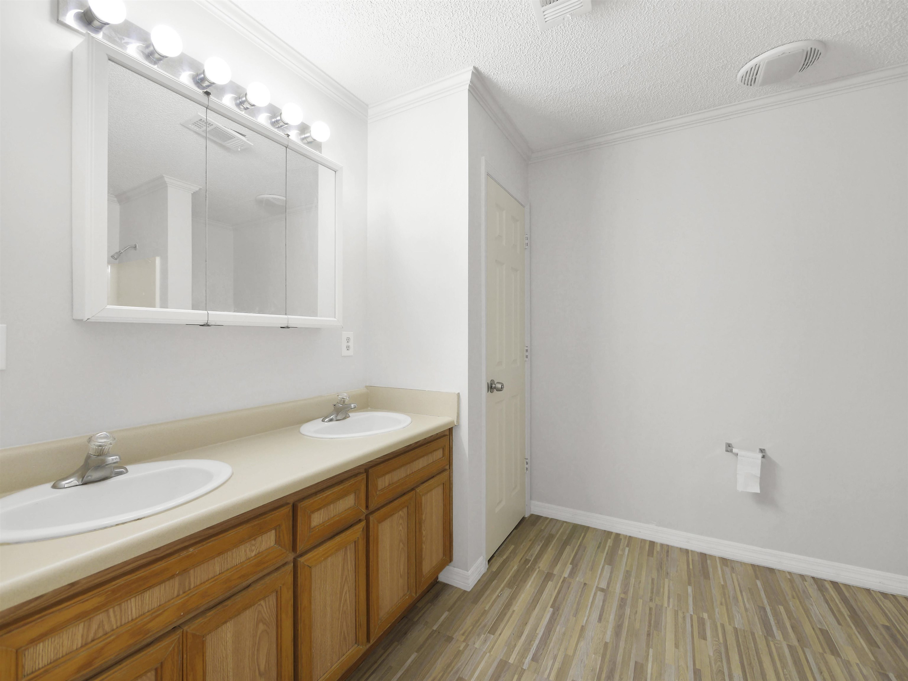 50 Spring Street St. Augustine, FL 32084 - Photo 13 of 30 a bathroom with a sink and a mirror