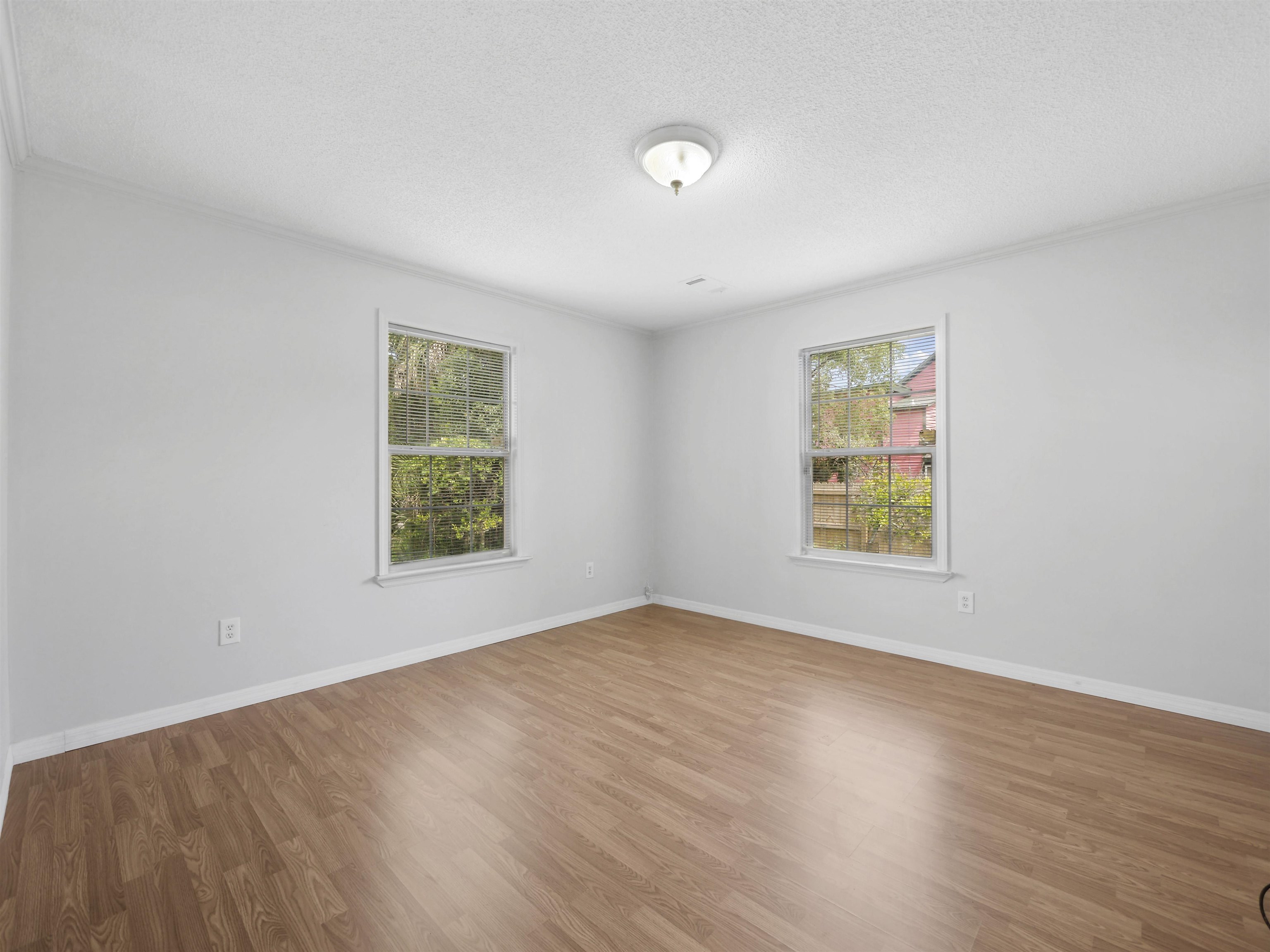 50 Spring Street St. Augustine, FL 32084 - Photo 19 of 30 an empty room with windows