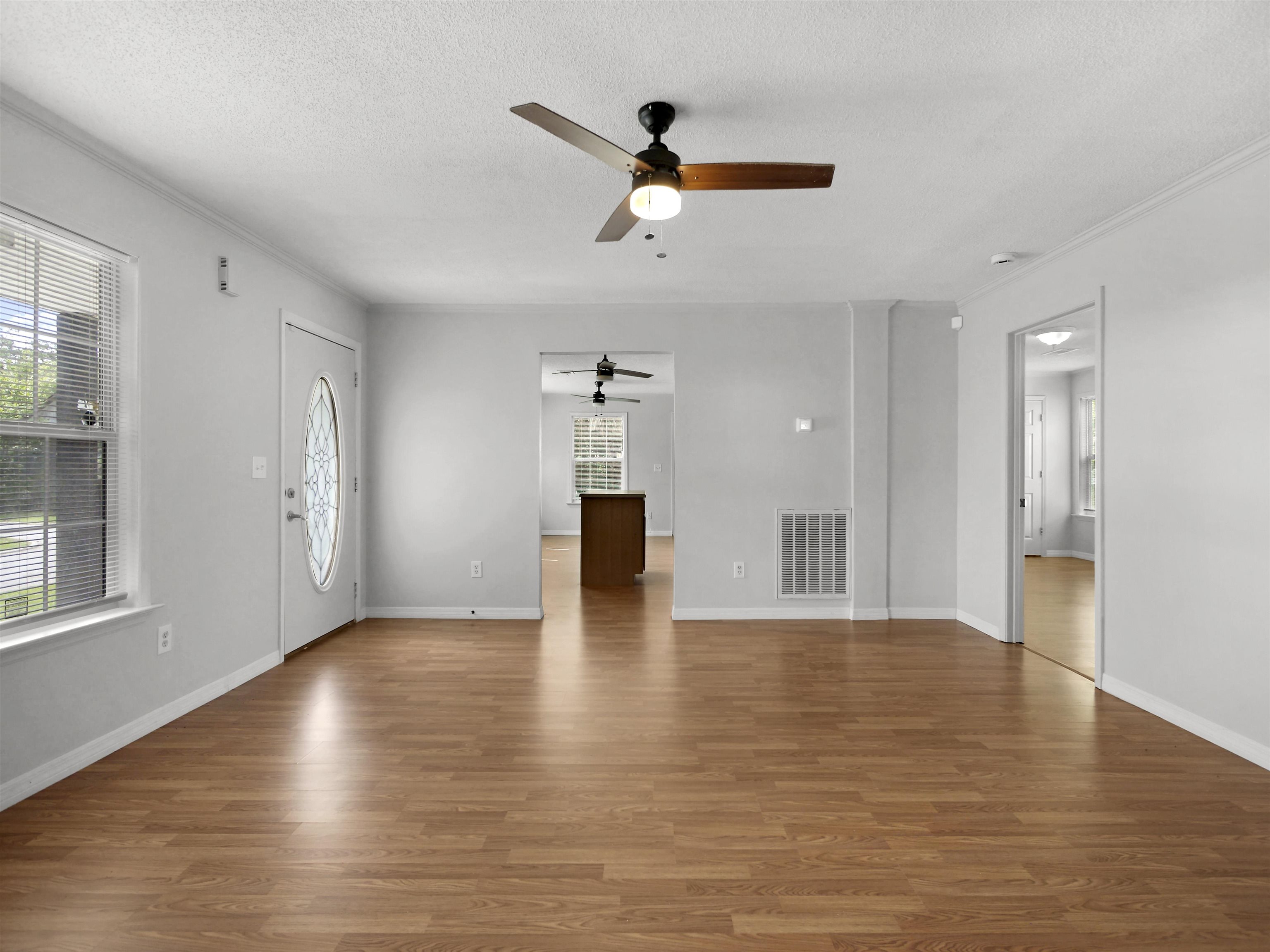 50 Spring Street St. Augustine, FL 32084 - Photo 2 of 30 a view of empty room with wooden floor and windows