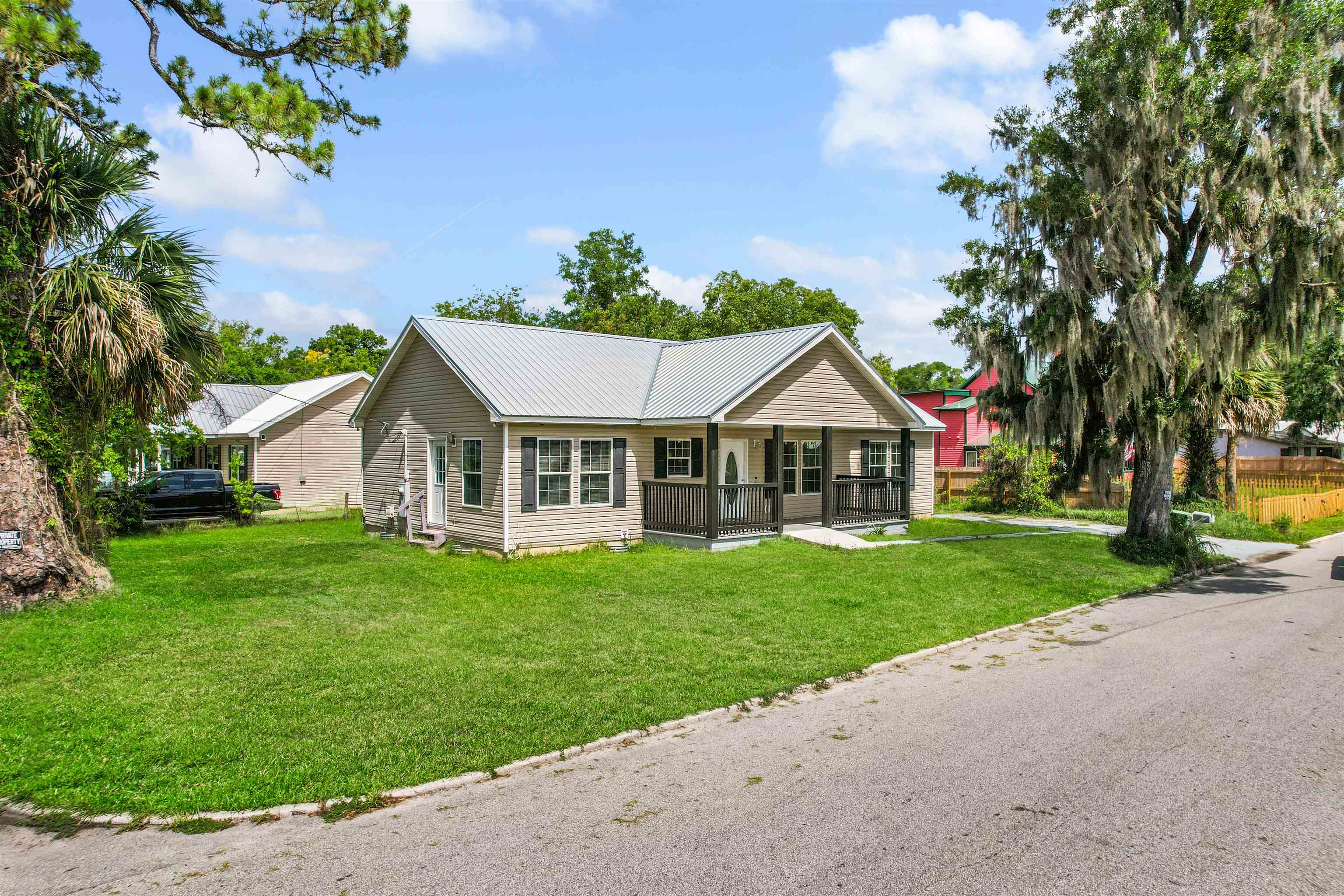 50 Spring Street St. Augustine, FL 32084 - Photo 24 of 30 a view of house with outdoor space and garden