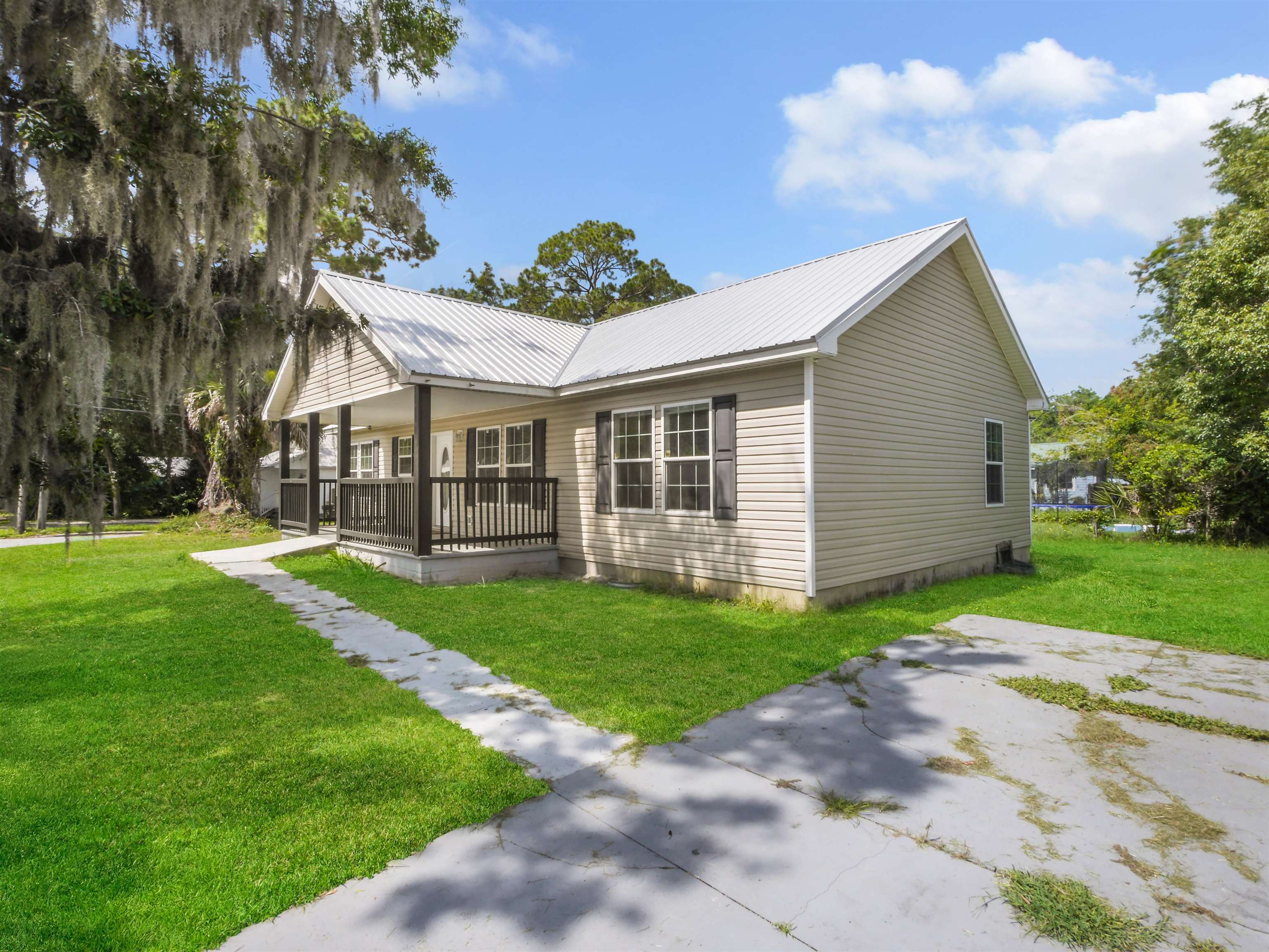50 Spring Street St. Augustine, FL 32084 - Photo 25 of 30 a view of a house with a yard