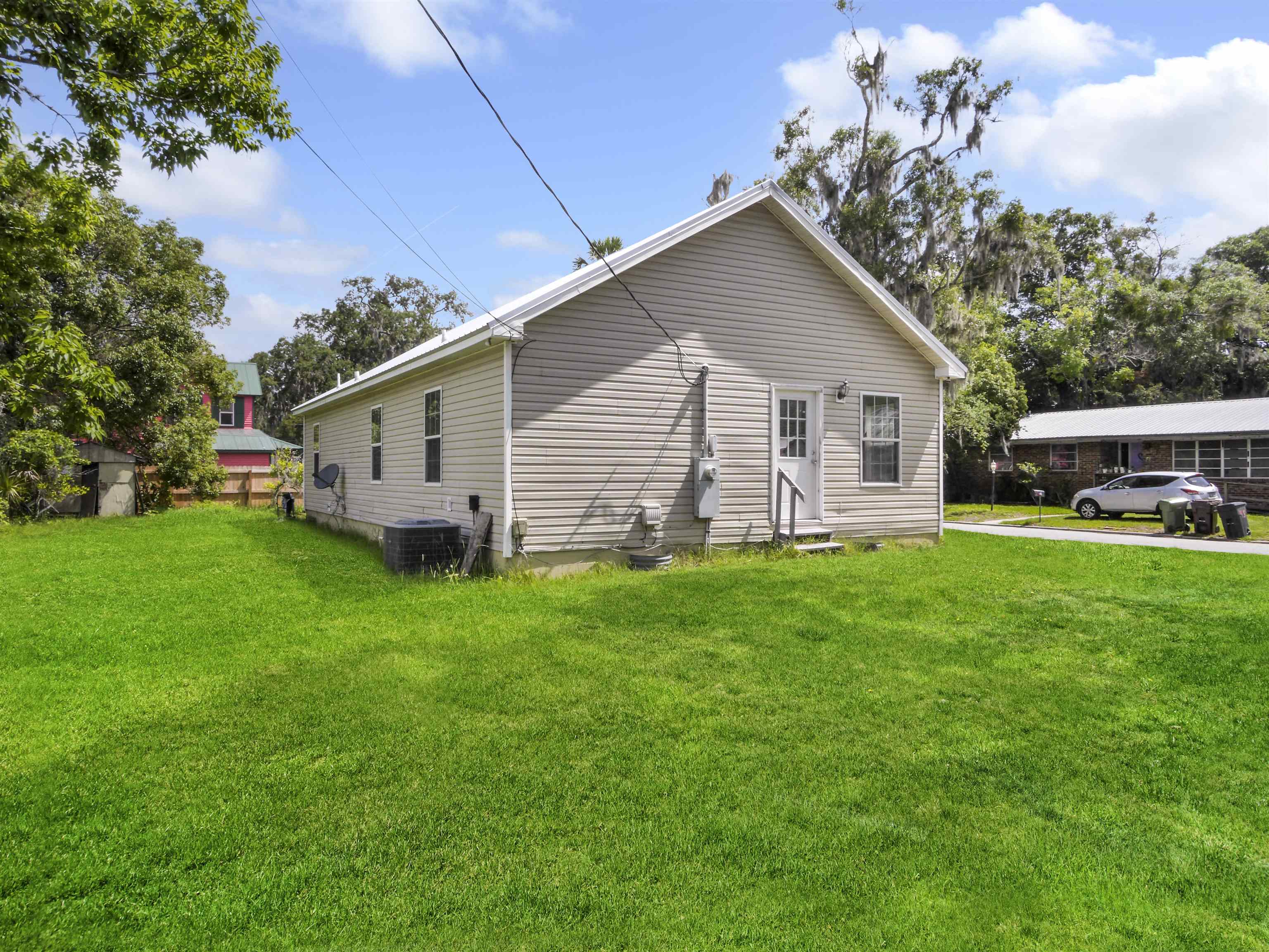 50 Spring Street St. Augustine, FL 32084 - Photo 26 of 30 a view of a house with a yard and garden