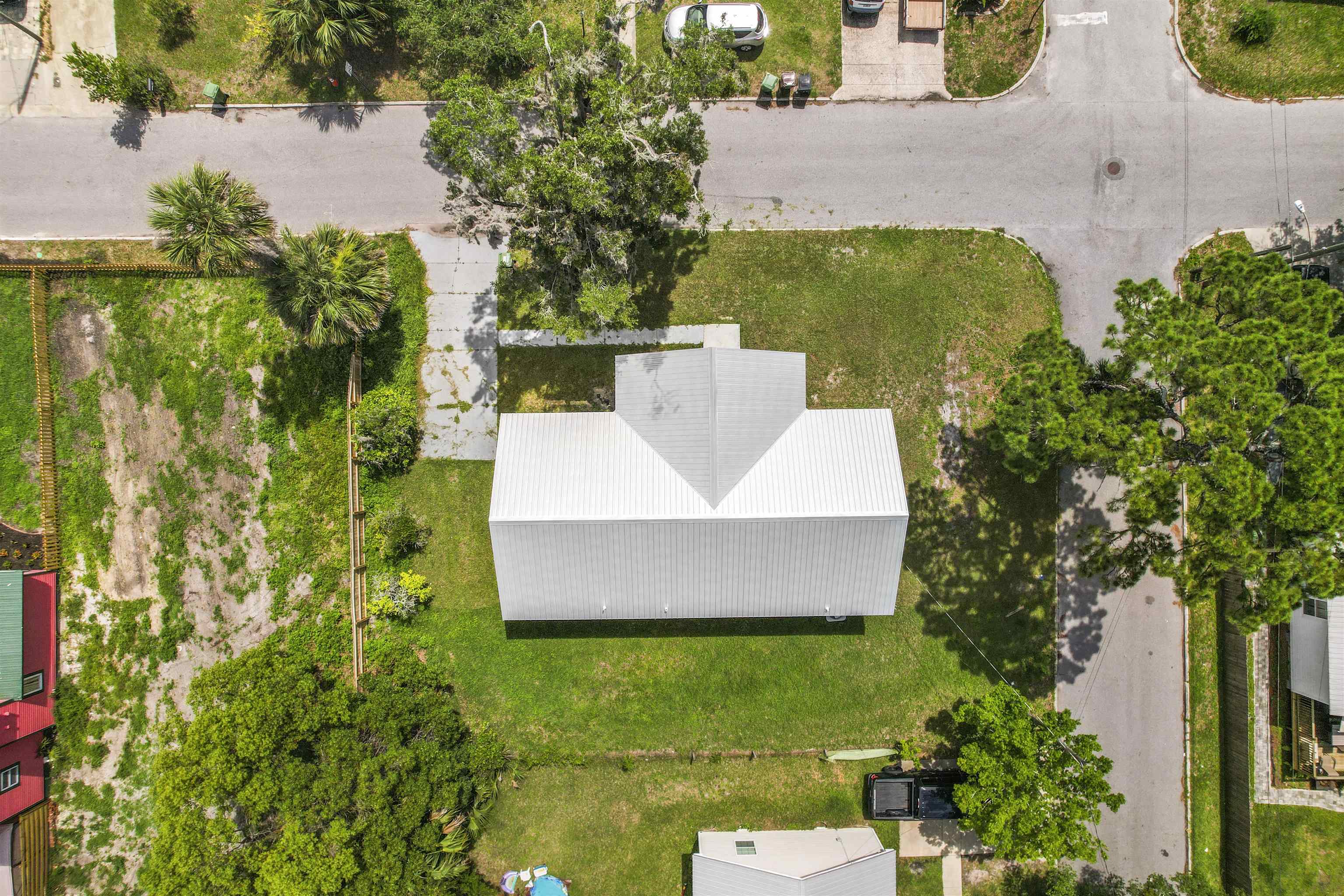 50 Spring Street St. Augustine, FL 32084 - Photo 27 of 30 an aerial view of a house with swimming pool and garden