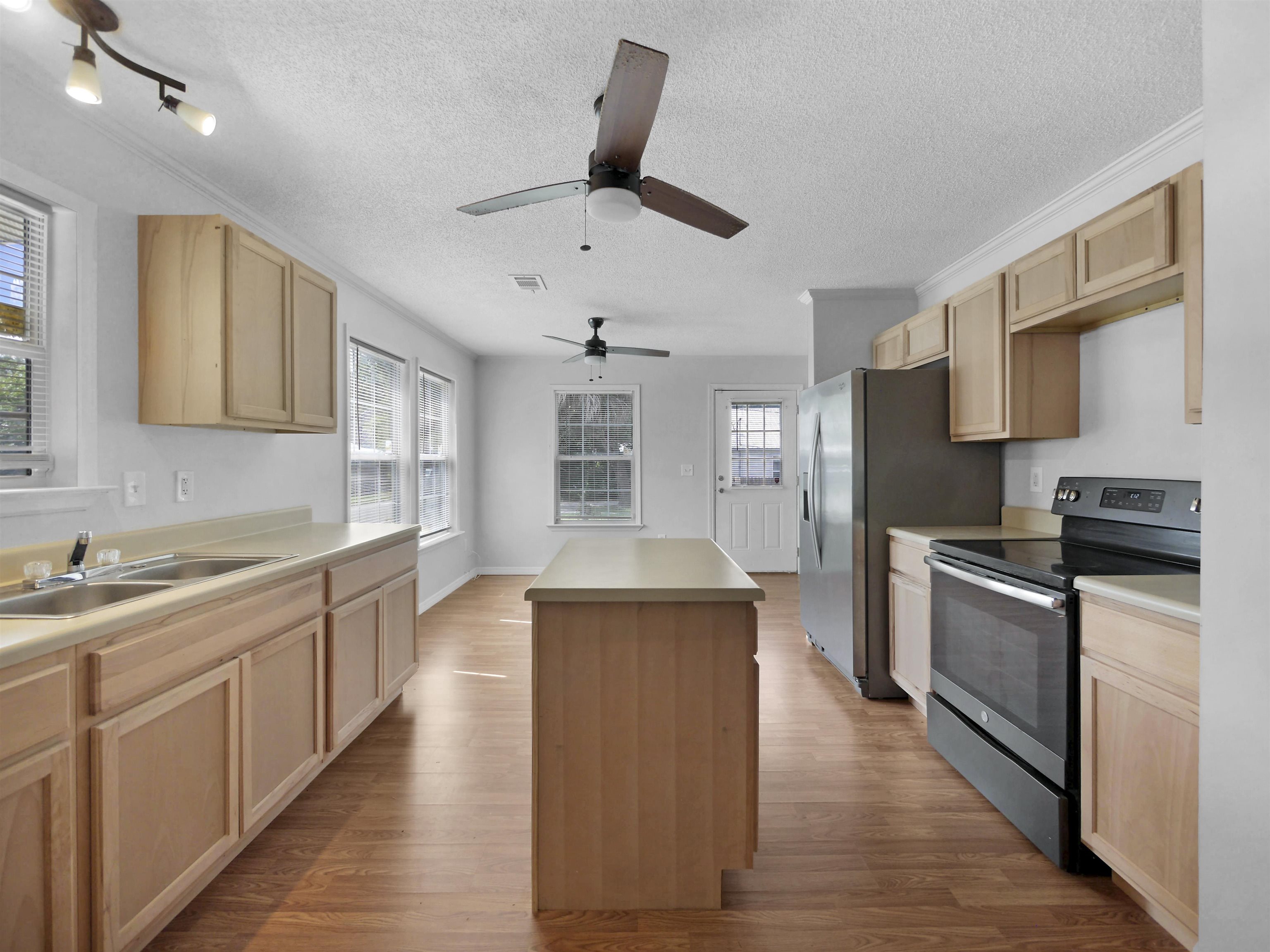 50 Spring Street St. Augustine, FL 32084 - Photo 6 of 30 a large kitchen with a stove top oven a sink dishwasher and wooden floor