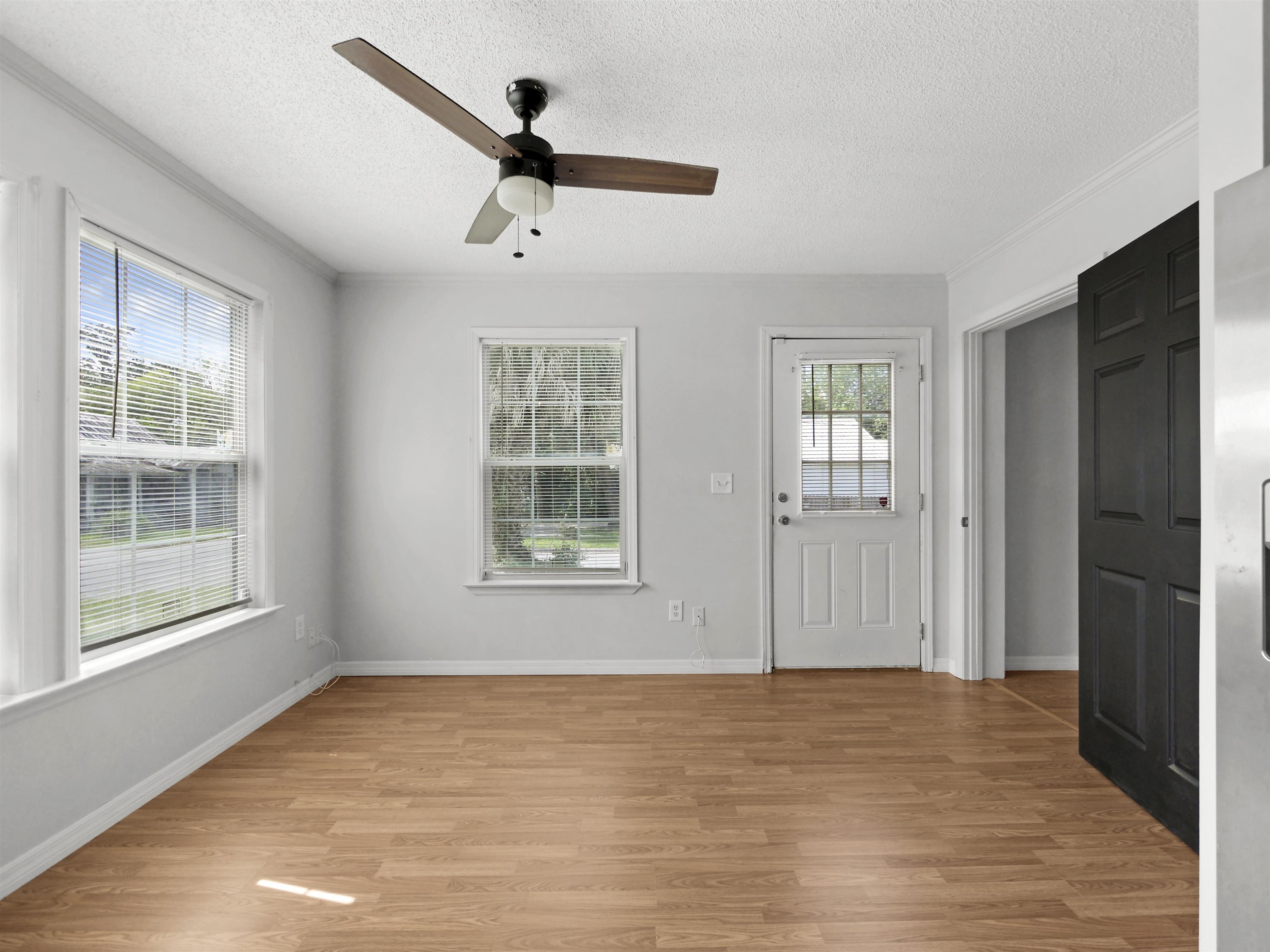 50 Spring Street St. Augustine, FL 32084 - Photo 9 of 30 a view of an empty room with wooden floor and a window