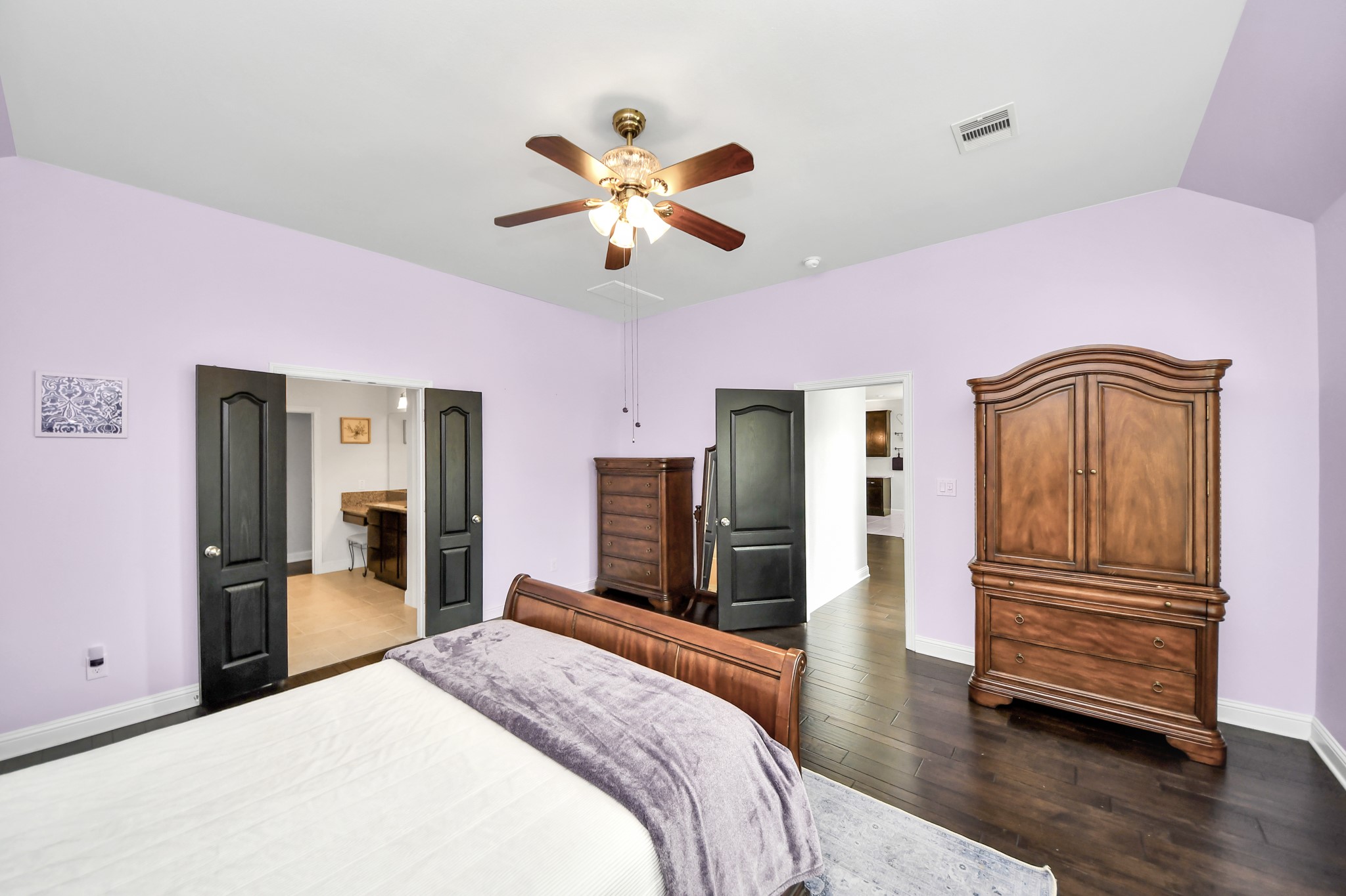 2811 Hadley Springs Lane Spring, TX 77386 - Photo 20 of 50 a bedroom with a bed and a chandelier