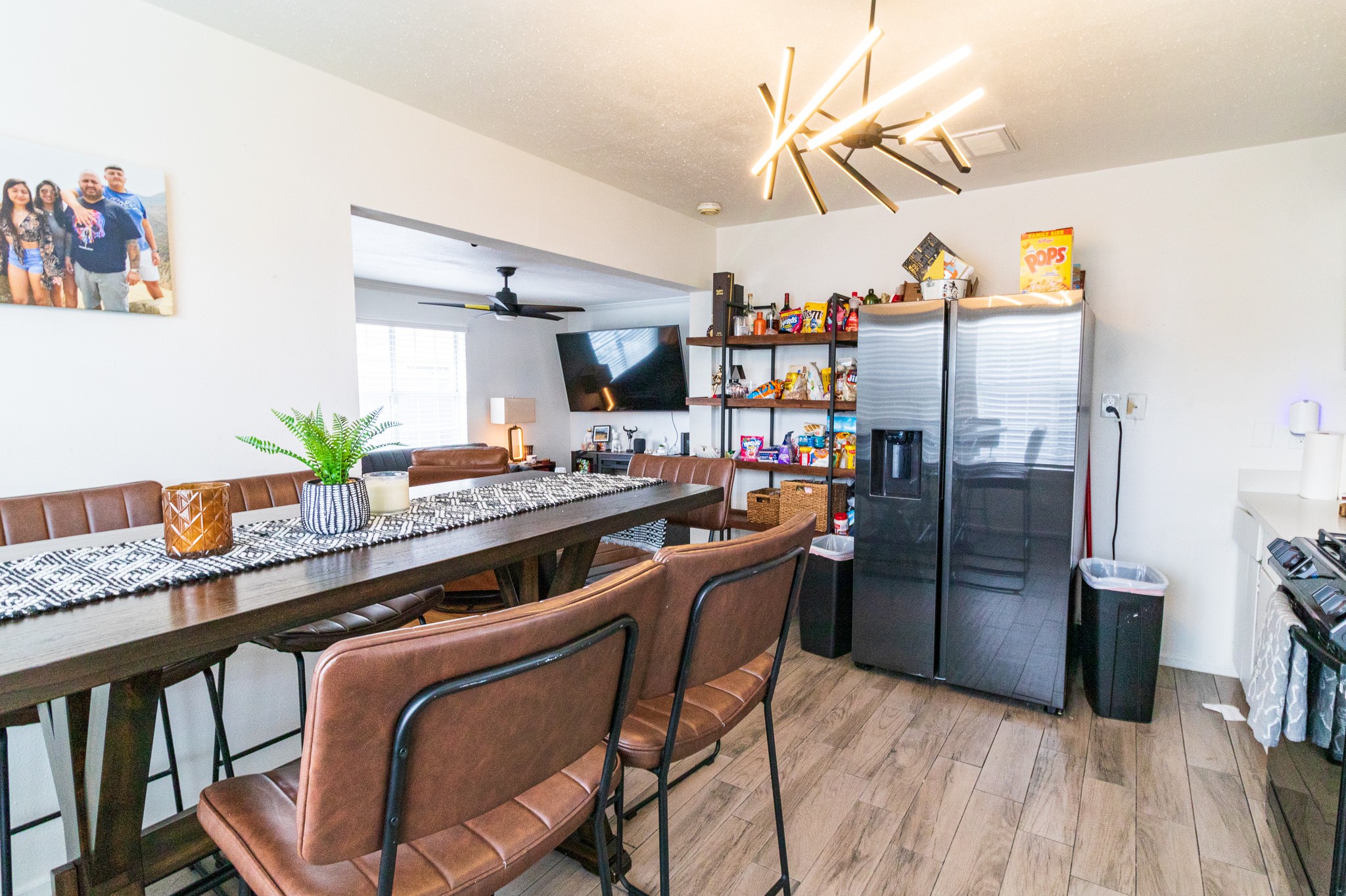 326 West 28th Street Houston, TX 77008 - Photo 11 of 22 a kitchen with stainless steel appliances kitchen island a table and chairs in it