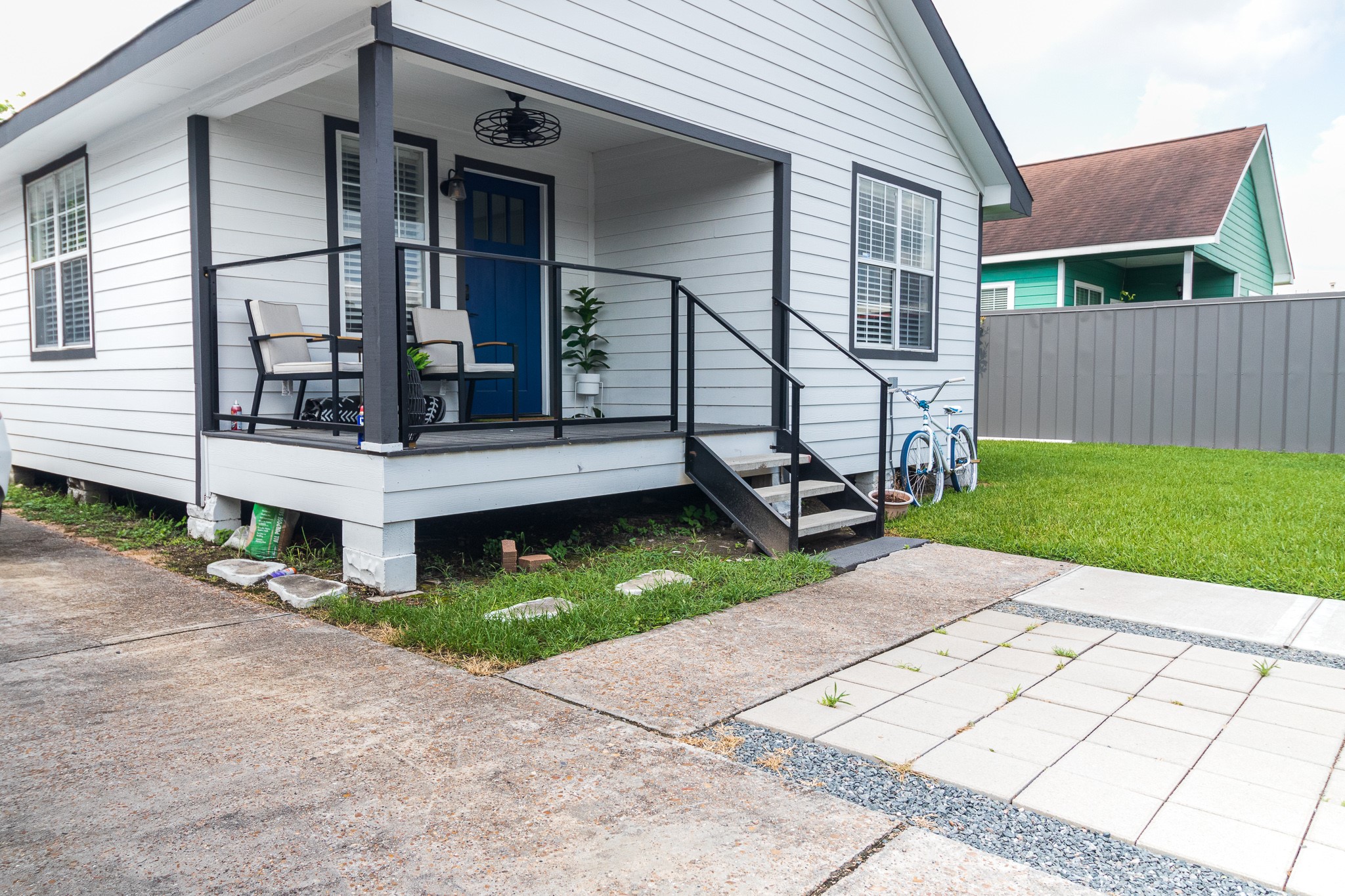326 West 28th Street Houston, TX 77008 - Photo 6 of 22 a view of a house with a small yard and wooden fence