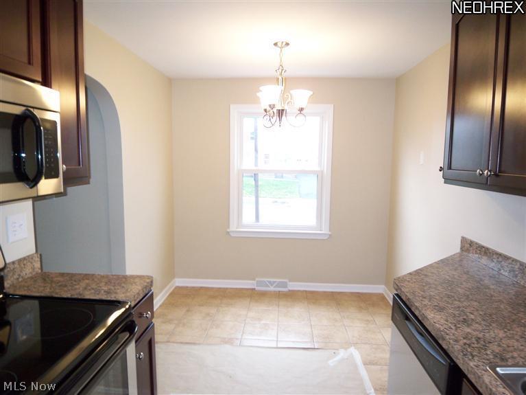 4121 Wilmington Road Cleveland, OH 44121 - Photo 5 of 12 The dinette is located at the end of the kitchen