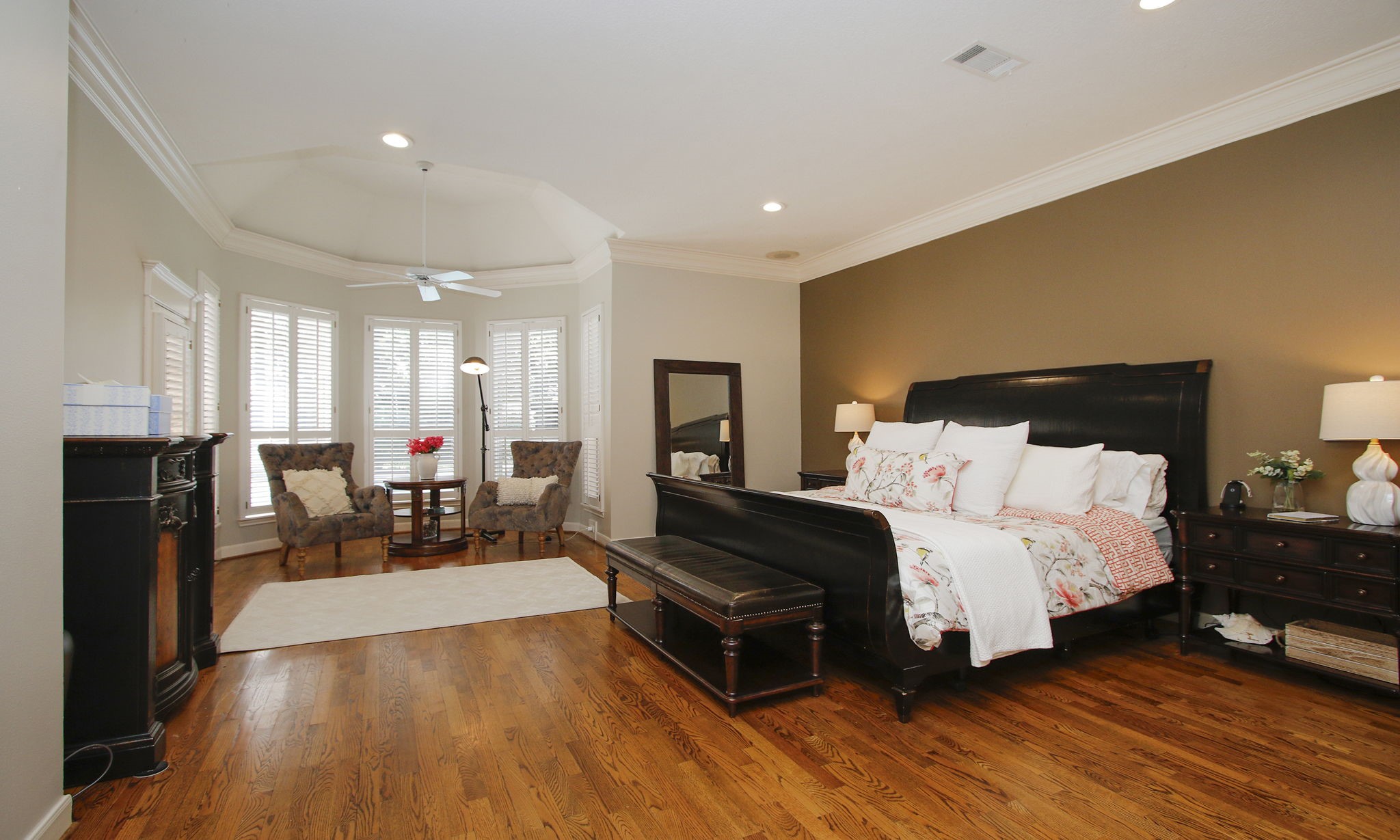15923 Harwick Drive Spring, TX 77379 - Photo 13 of 50 Across the hall from the office is this stunning primary bedroom with hard wood floors and sitting area with a door to the outside patio.
