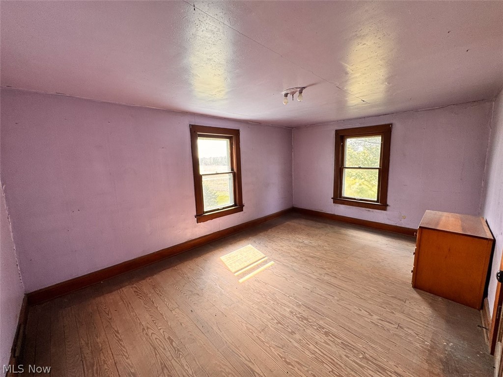 15 Glecoe Road Southwest Carrollton, OH 44615 - Photo 48 of 50 Unfurnished room featuring hardwood / wood-style floors and healthy amount of natural light