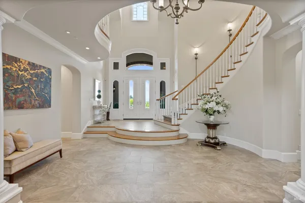 a kitchen with stainless steel appliances granite countertop a sink a oven and a stove