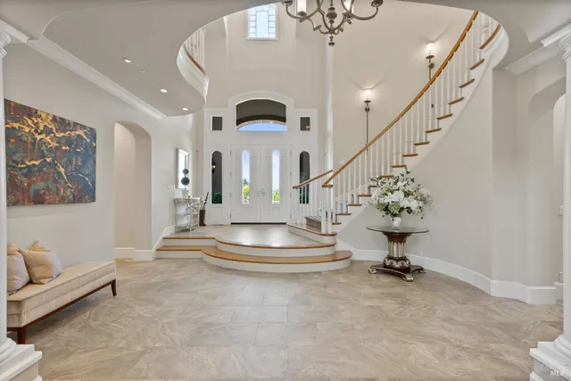 a kitchen with stainless steel appliances granite countertop a sink a oven and a stove