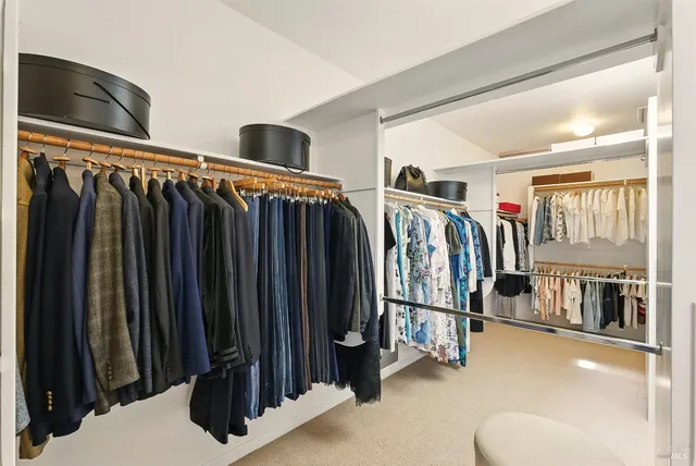 front view of a house with a lot of flower plants