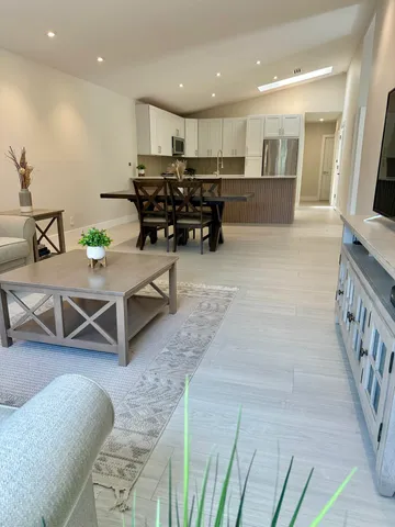 a bathroom with a shower a mirror and a sink