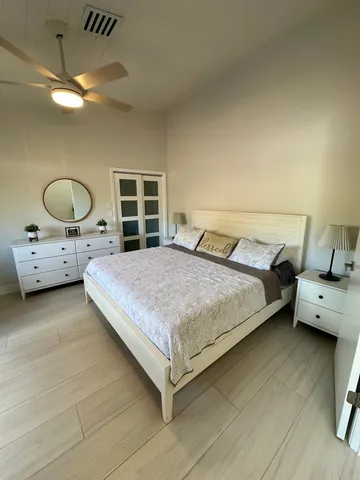 a bedroom with a bed and window
