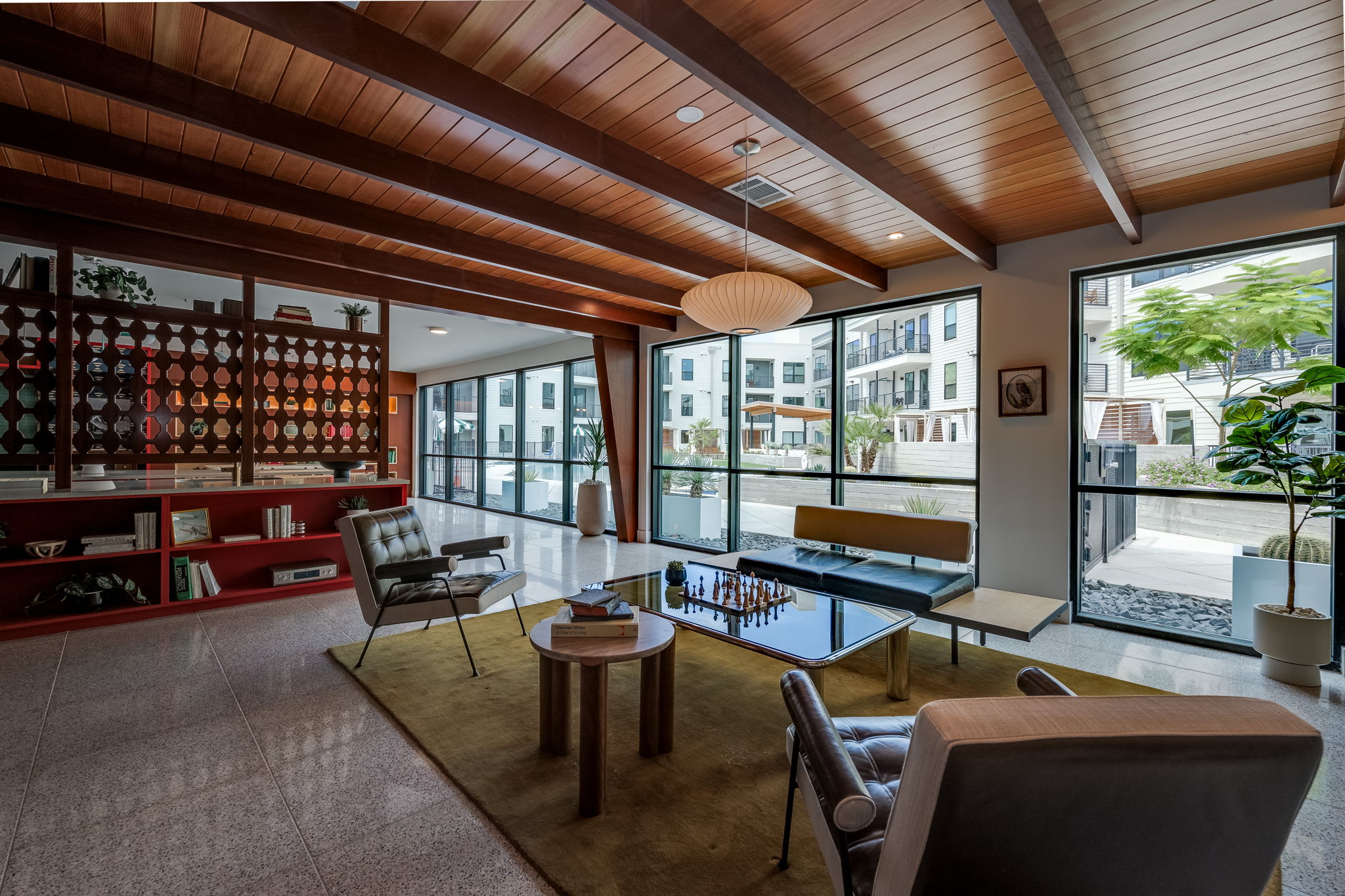 1701 Simond Avenue, Unit 618 Austin, TX 78723 - Photo 33 of 38 This living area features a distinctive wood-beamed ceiling and large windows that provide an abundance of natural light