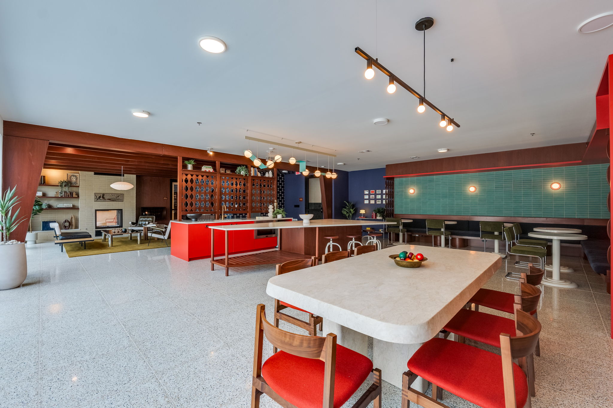 1701 Simond Avenue, Unit 618 Austin, TX 78723 - Photo 34 of 38 This inviting common area features a spacious layout with terrazzo flooring, a large island with seating, and a dining table with chairs