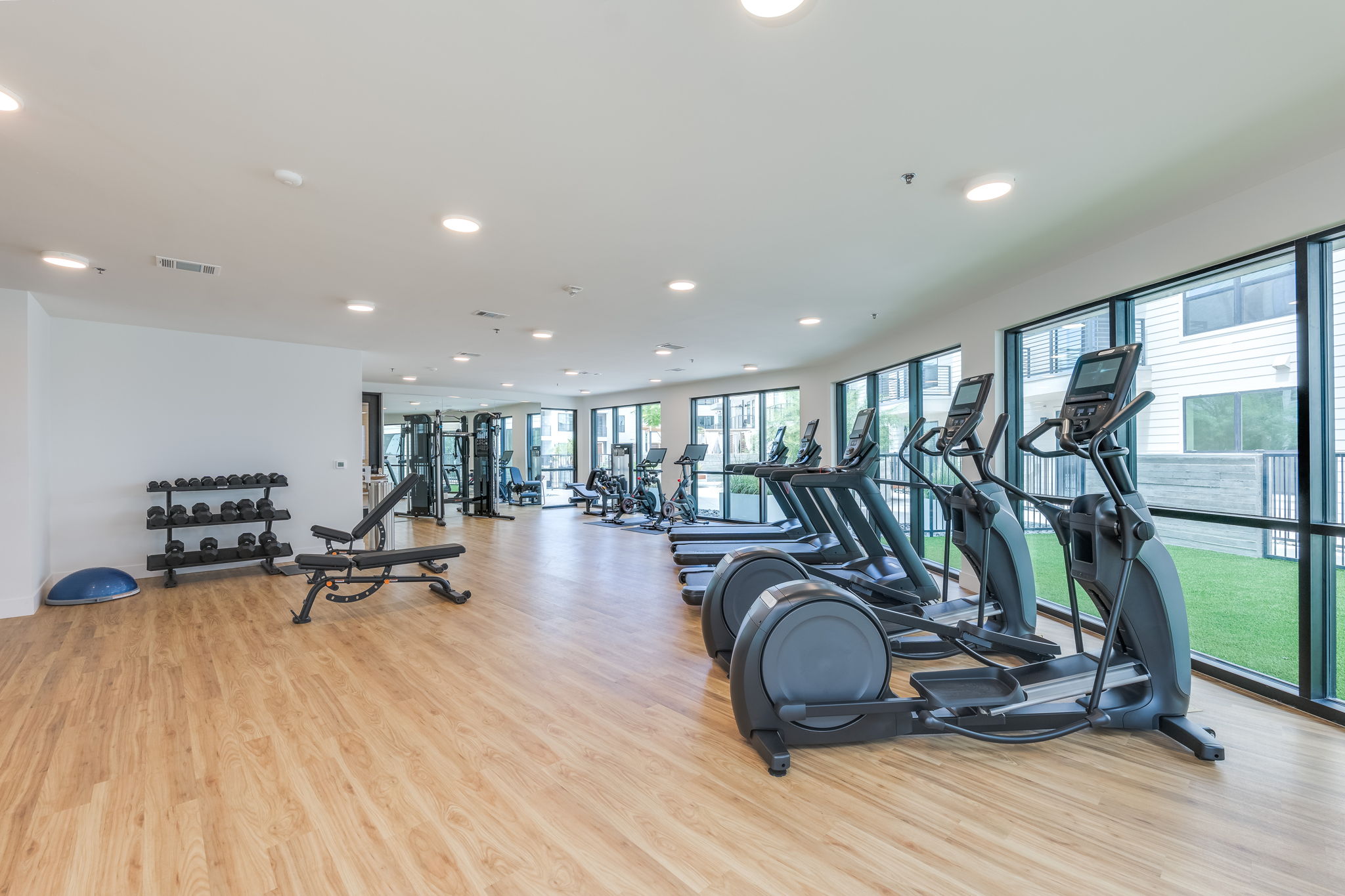 1701 Simond Avenue, Unit 618 Austin, TX 78723 - Photo 36 of 38 The fitness center offers a variety of exercise equipment including treadmills, elliptical machines, and free weights, all set on a light wood-look floor