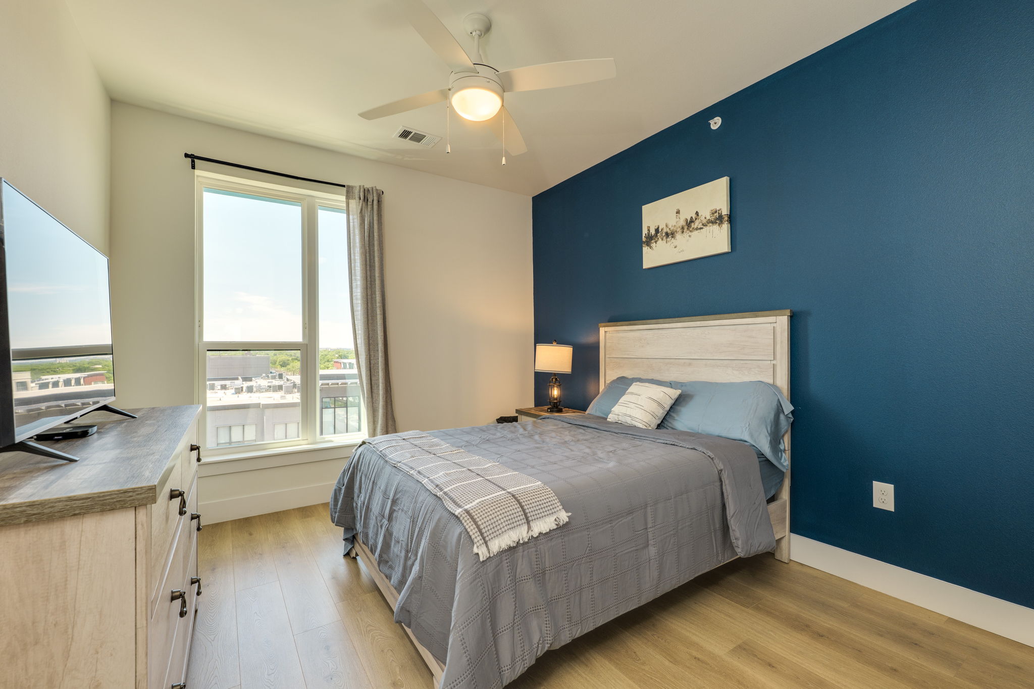 1701 Simond Avenue, Unit 618 Austin, TX 78723 - Photo 7 of 38 This room features a ceiling fan, a window with a view, and light-toned flooring