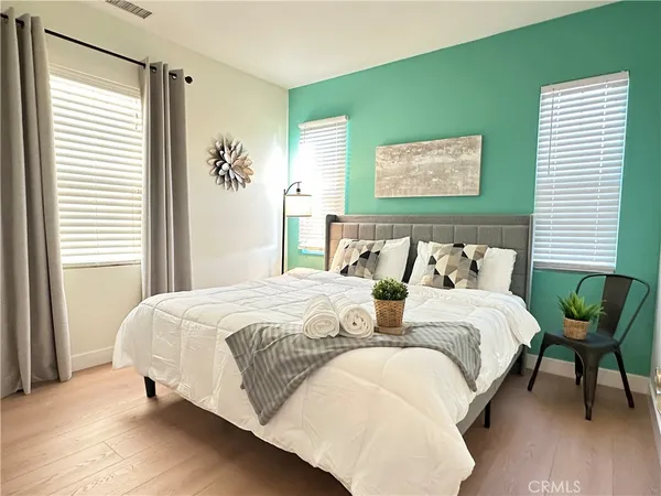 a bedroom with bed and window