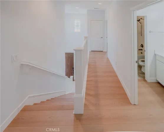 a view of a hallway with white walls