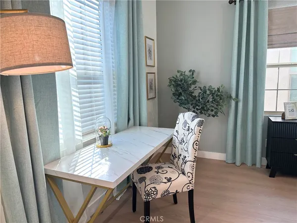 a view of a dining room with furniture and window