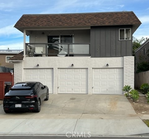 a view of a car parked front of a house