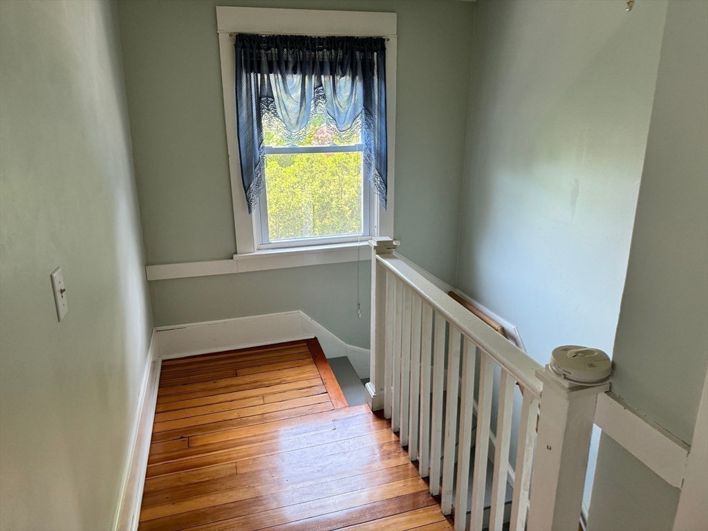 14 Field Street Seekonk, MA 02771 - Photo 16 of 26 a view of hallway with wooden floor and a window