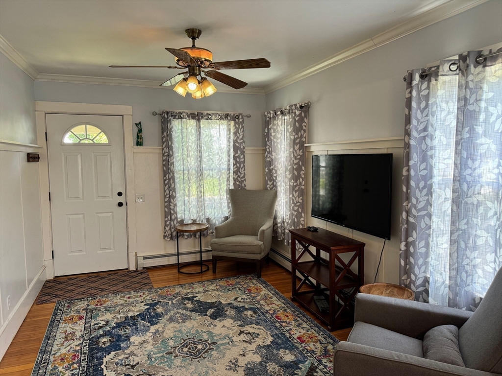 14 Field Street Seekonk, MA 02771 - Photo 6 of 26 a living room with furniture and a flat screen tv