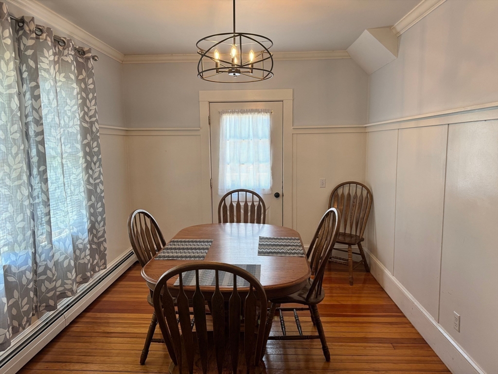 14 Field Street Seekonk, MA 02771 - Photo 8 of 26 a view of a dining room with furniture wooden floor and a chandelier