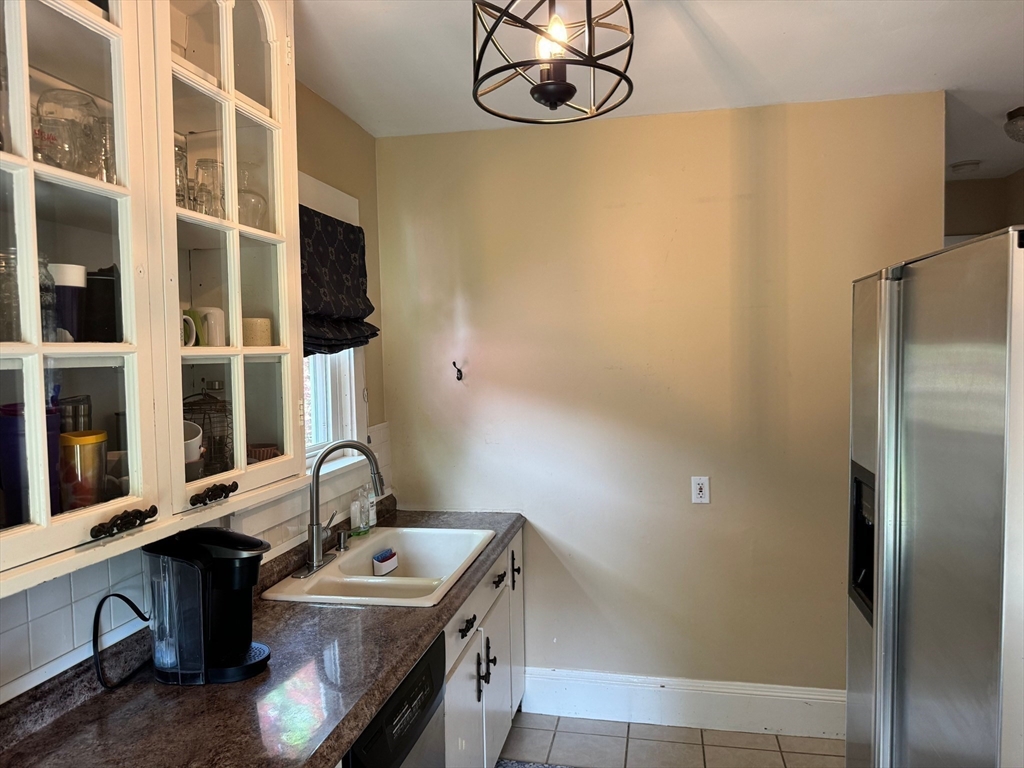 14 Field Street Seekonk, MA 02771 - Photo 10 of 26 a bathroom with a sink and a mirror