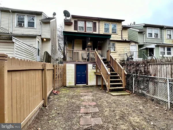 a front view of a house with stairs