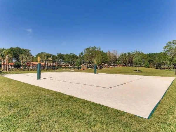 a swimming pool with outdoor seating and yard
