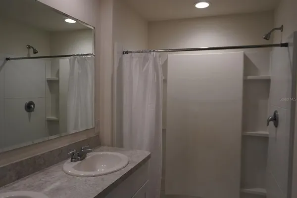 a white toilet sitting next to a bathroom sink
