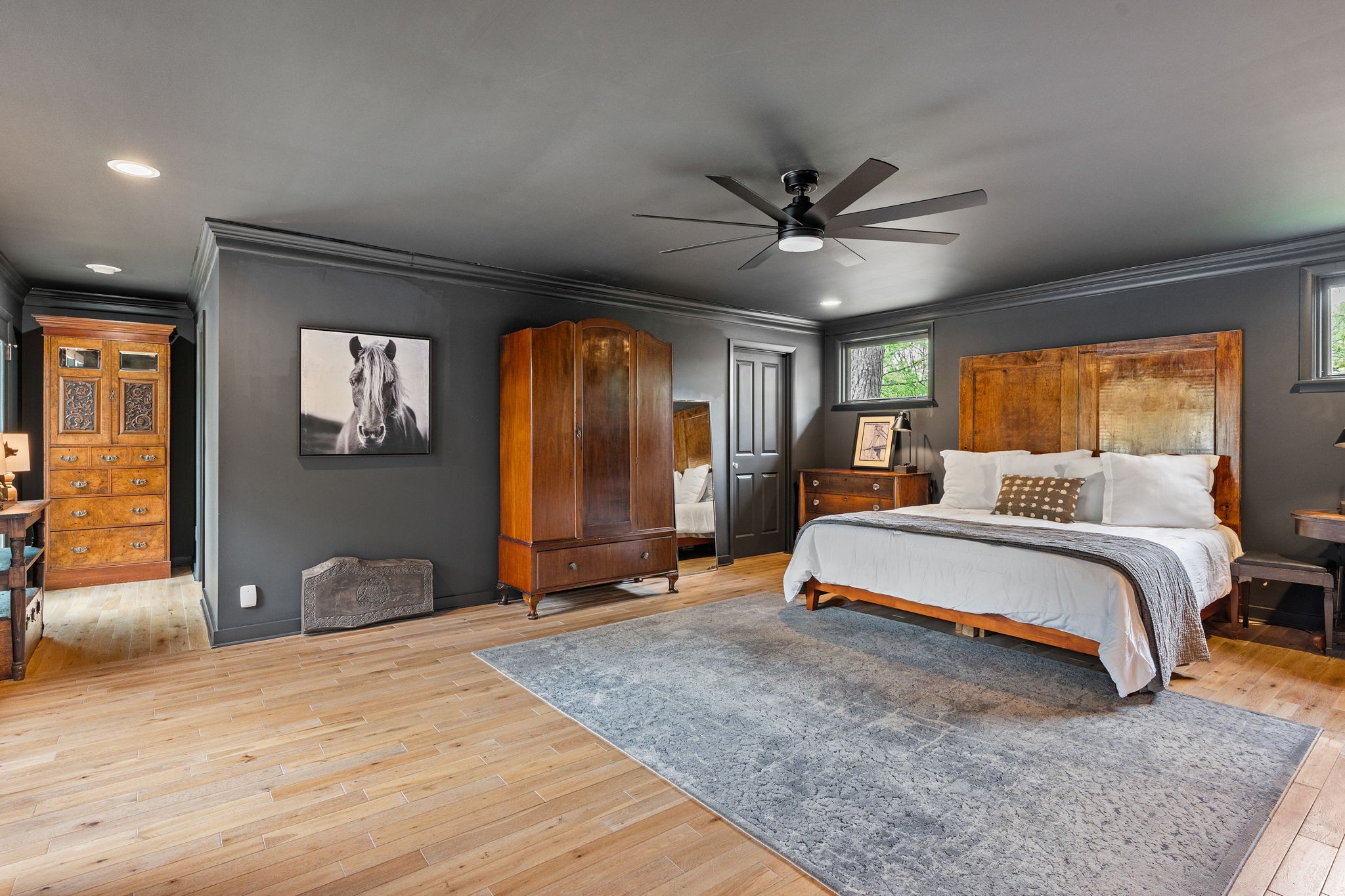 1004 Hickory Hollow Road Nashville, TN 37221 - Photo 18 of 41 a spacious bedroom with a large bed and a chandelier
