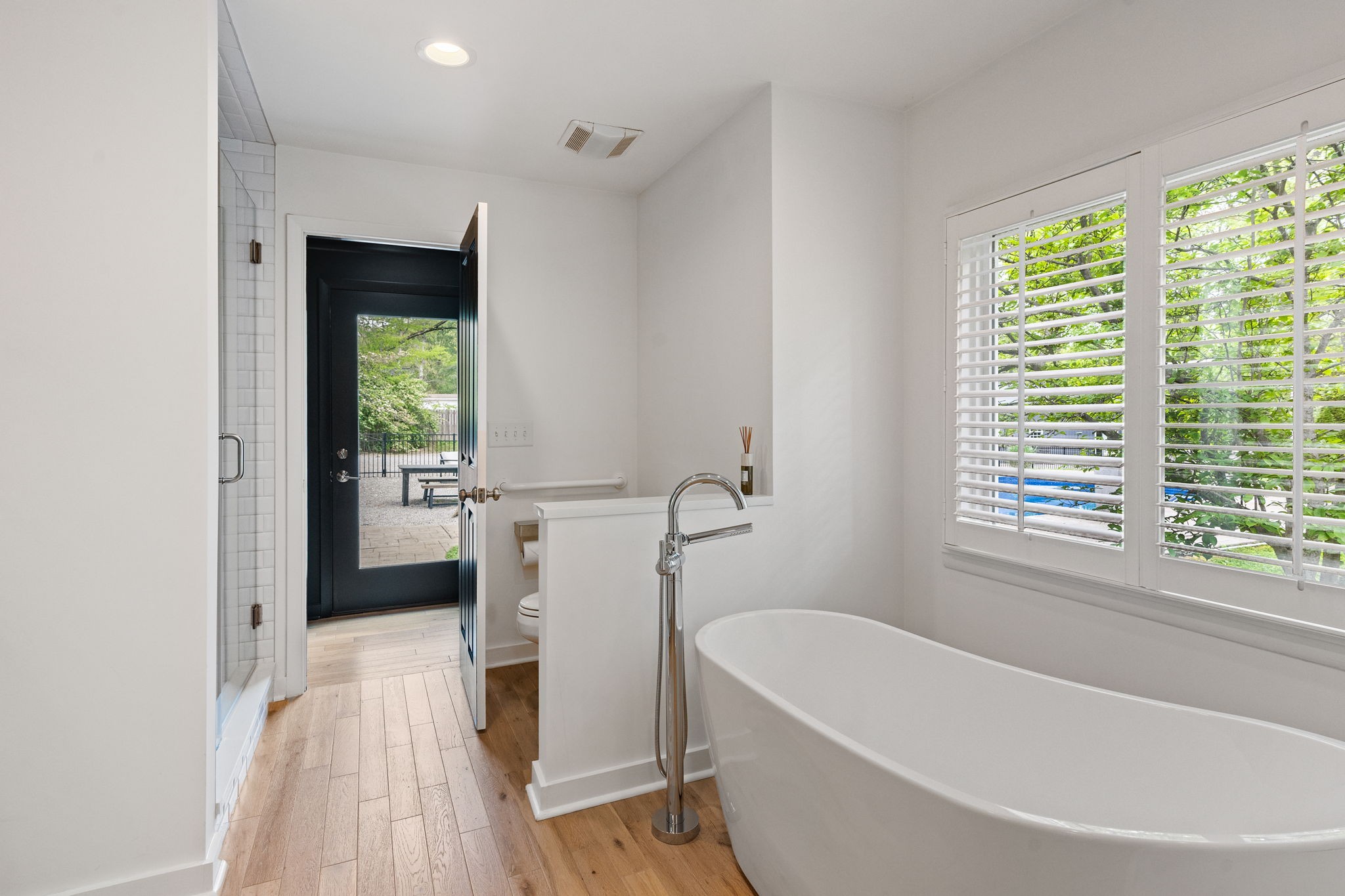 1004 Hickory Hollow Road Nashville, TN 37221 - Photo 21 of 41 a bathroom with a bathtub a toilet a sink and a window