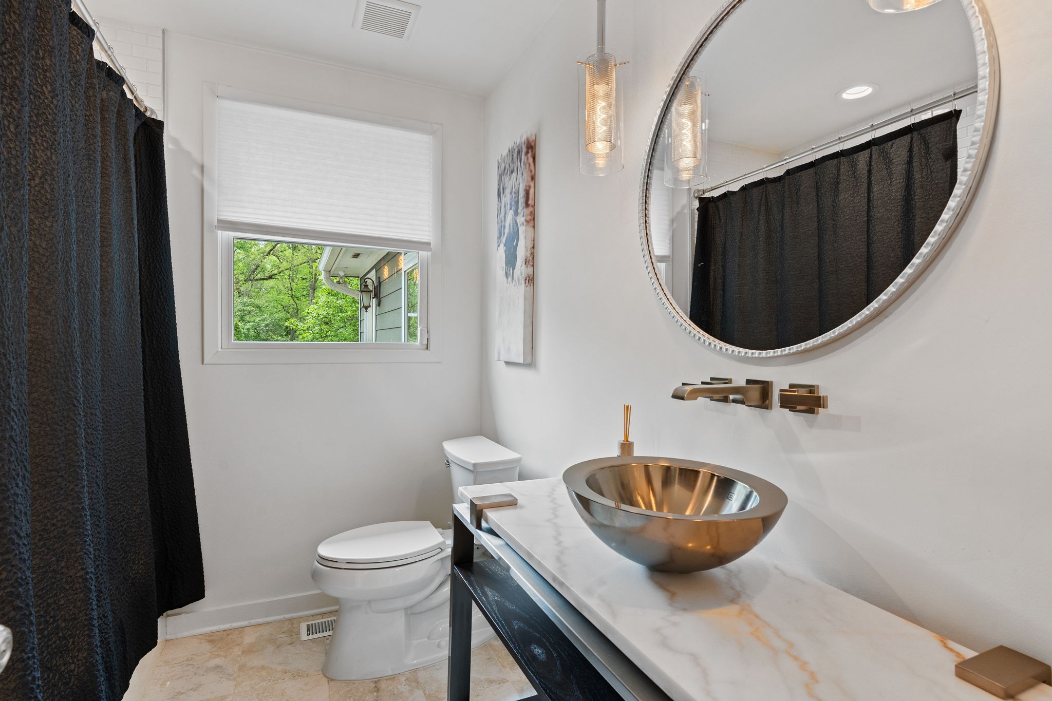 1004 Hickory Hollow Road Nashville, TN 37221 - Photo 26 of 41 a bathroom with a toilet a sink and mirror